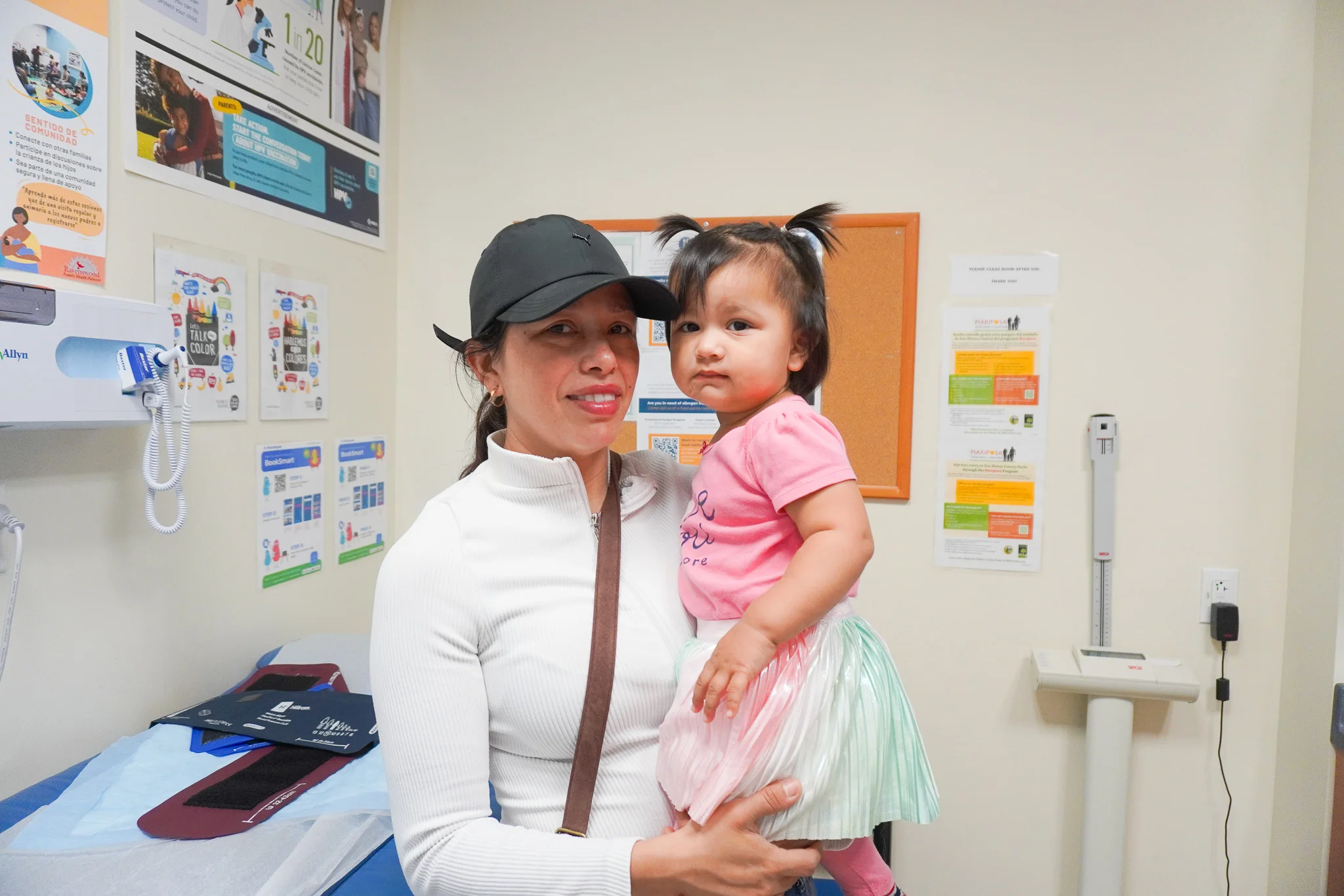A Ravenswood pediatrician examining a young child during a wellness visit